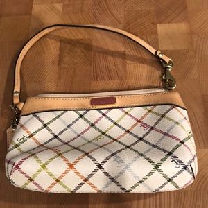 Coach wristlet with Coach logo.